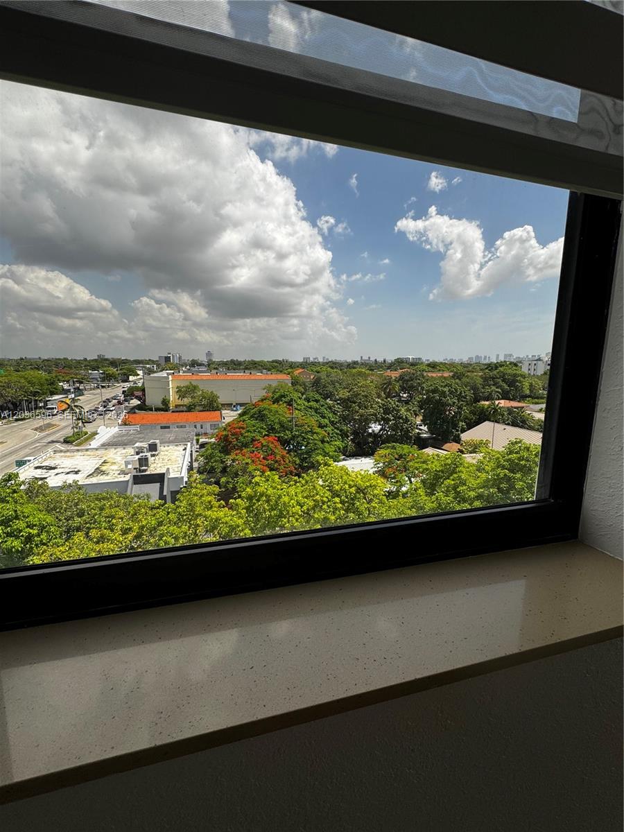 2301 Southwest 27th Avenue, Unit 503 Miami, FL 33145 - Photo 20 of 24 a view of a lake from a window