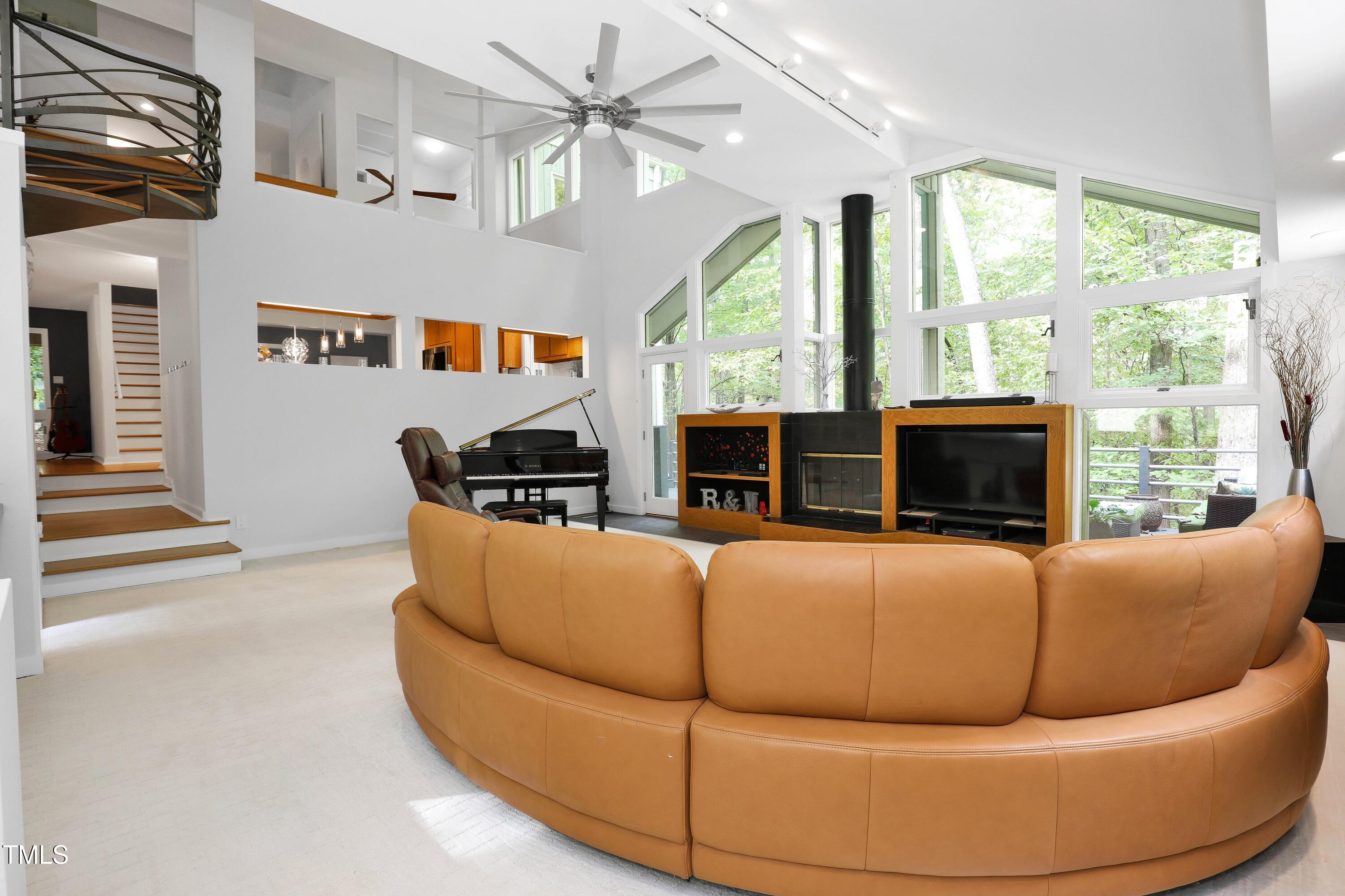 11312 Old Creedmoor Road Raleigh, NC 27613 - Photo 28 of 62 a living room with furniture fireplace and a large window