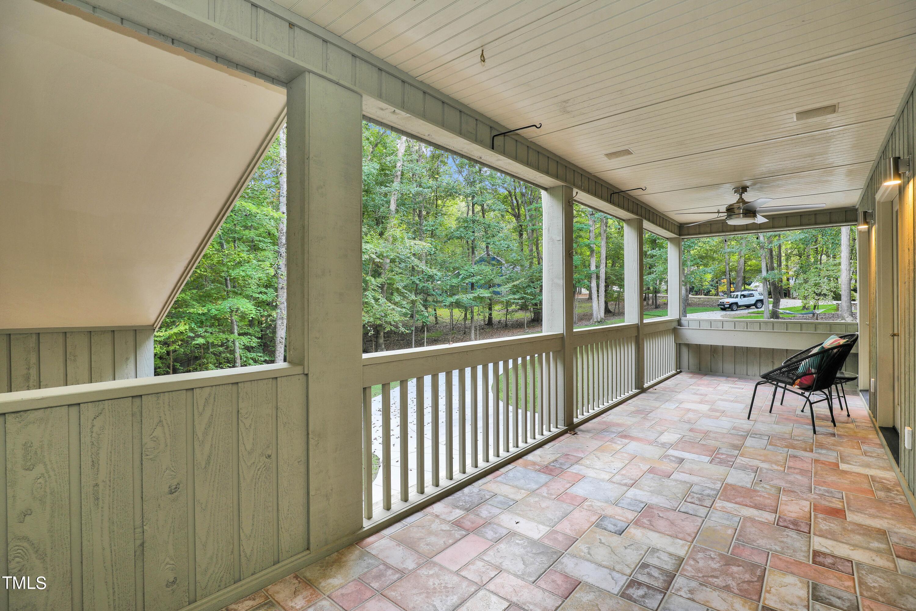 11312 Old Creedmoor Road Raleigh, NC 27613 - Photo 38 of 62 a view of a porch with furniture and a yard