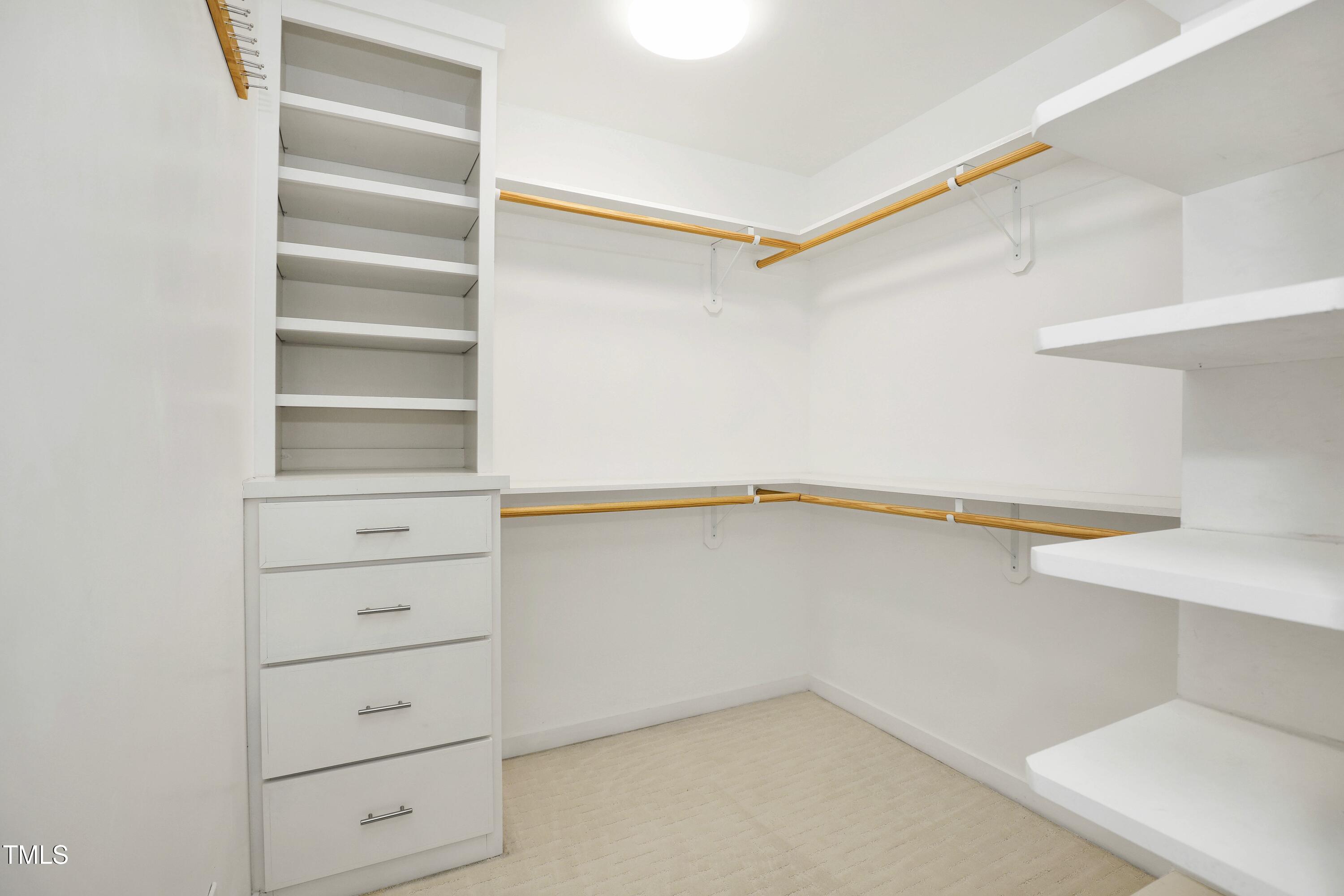 11312 Old Creedmoor Road Raleigh, NC 27613 - Photo 44 of 62 a view of an empty walk in closet