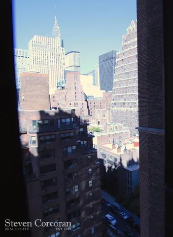 a bathroom with a sink a mirror and a shower