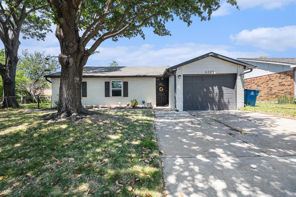 6305 Redwood Lane Rowlett, TX 75089 - Photo 1 of 29 a view of a house with a yard