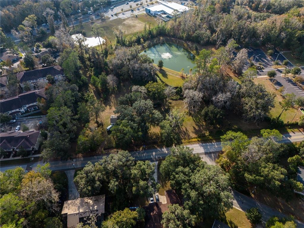 560 Northwest 39th Road Gainesville, FL 32607 - Photo 12 of 13 an aerial view of lake residential house with swimming pool and green space