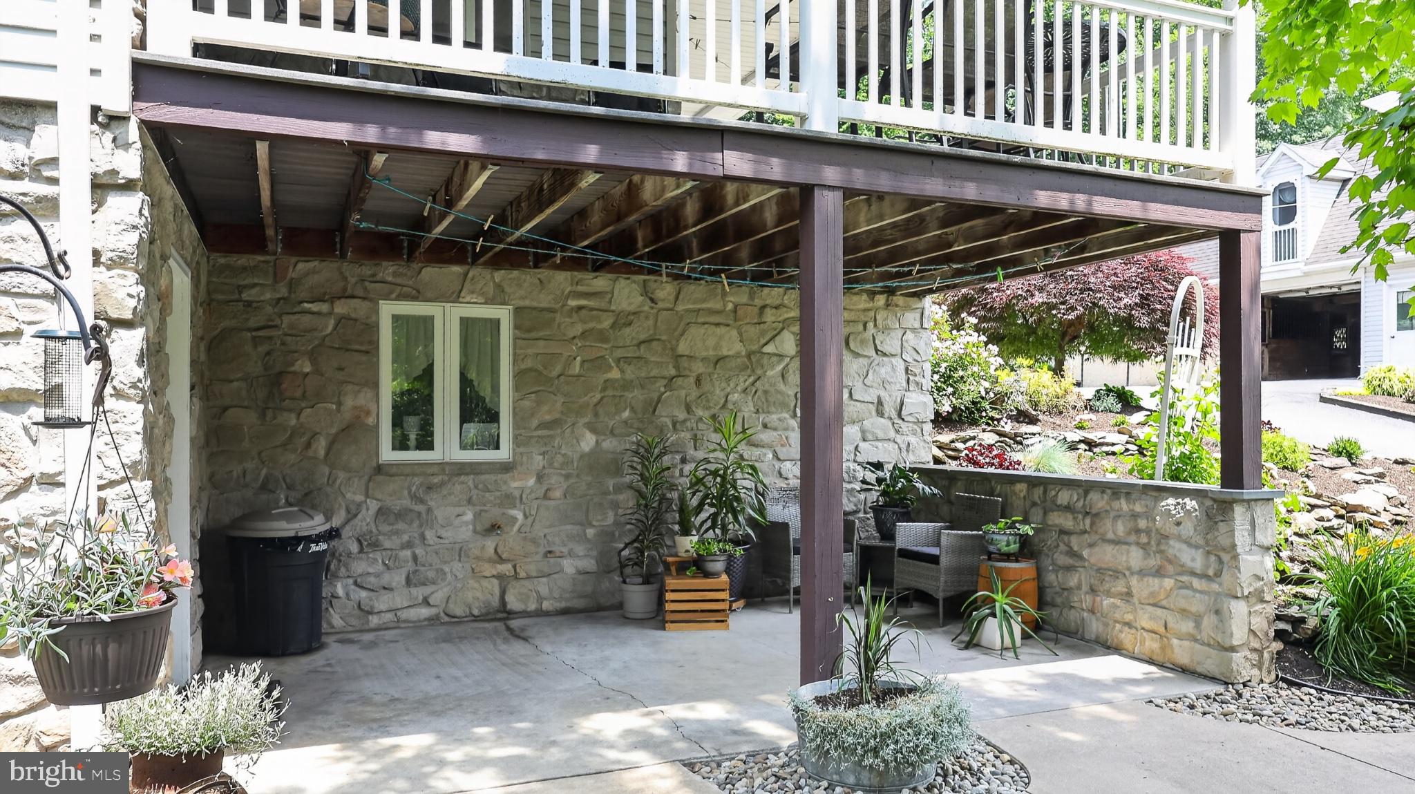 257 Hill Road New Holland, PA 17557 - Photo 37 of 94 Charming stone patio oasis awaits!