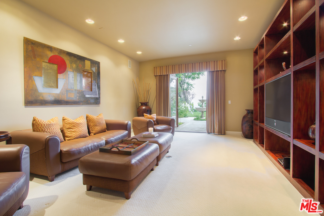 13951 Durham Road Beverly Hills, CA 90210 - Photo 12 of 29 a living room with furniture window and a flat screen tv