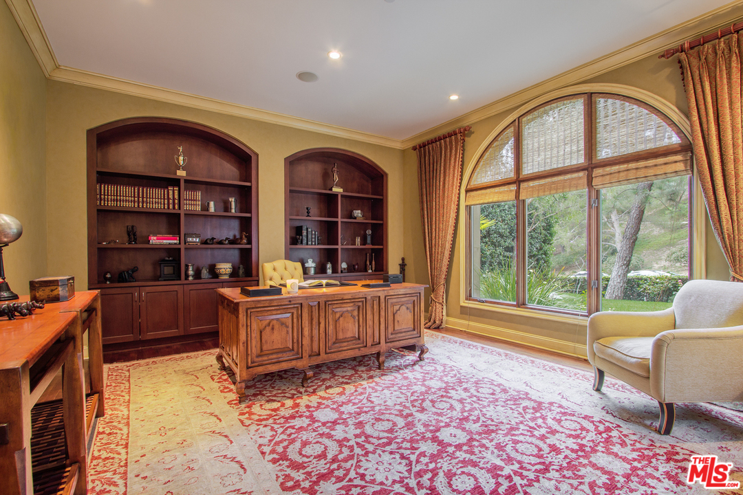13951 Durham Road Beverly Hills, CA 90210 - Photo 13 of 29 a living room with furniture and a large window