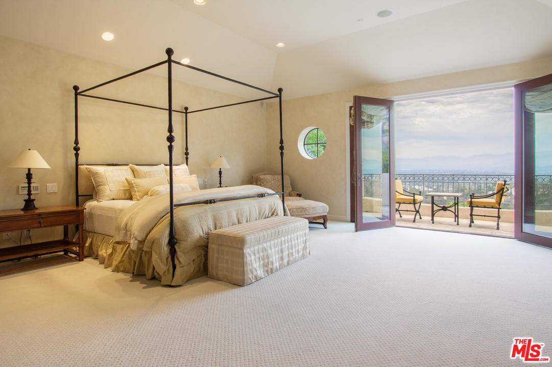 13951 Durham Road Beverly Hills, CA 90210 - Photo 14 of 29 a bedroom with bed and a window