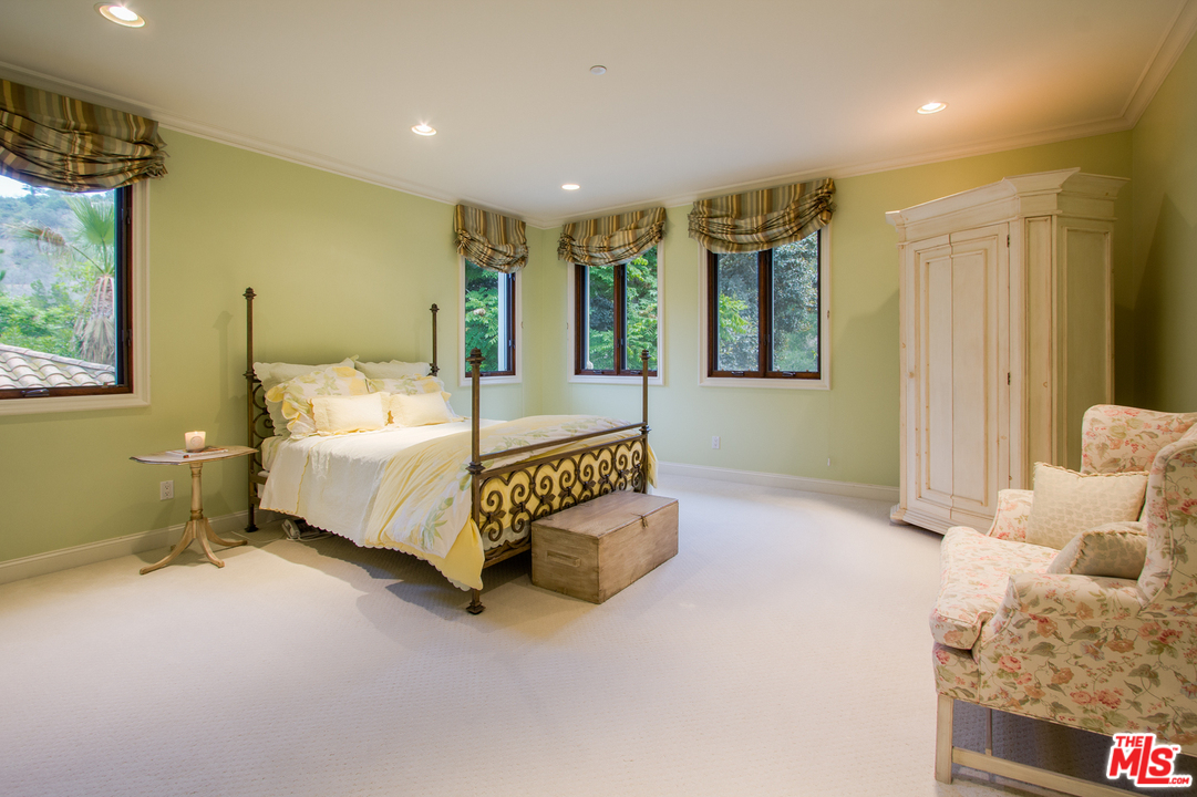 13951 Durham Road Beverly Hills, CA 90210 - Photo 19 of 29 a bed room with a bed and a window