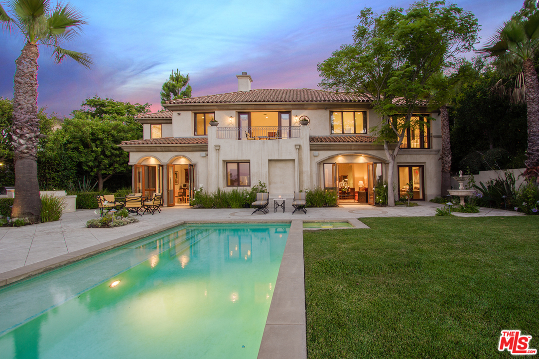 13951 Durham Road Beverly Hills, CA 90210 - Photo 22 of 29 a view of a house with a swimming pool