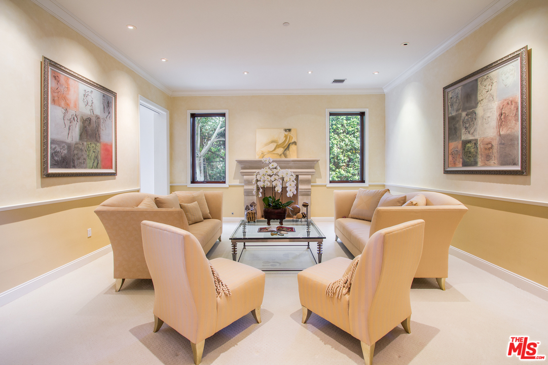 13951 Durham Road Beverly Hills, CA 90210 - Photo 5 of 29 a living room with furniture and a large window