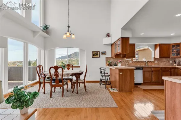 a view of a dining room with furniture window and wooden floor
