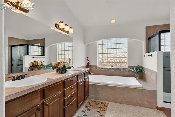 a bath tub sitting in a bathroom next to a window