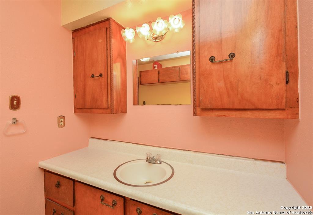 6646 1/2 Lodge Street Houston, TX 77092 - Photo 11 of 14 view of bathroom with a sink and mirror
