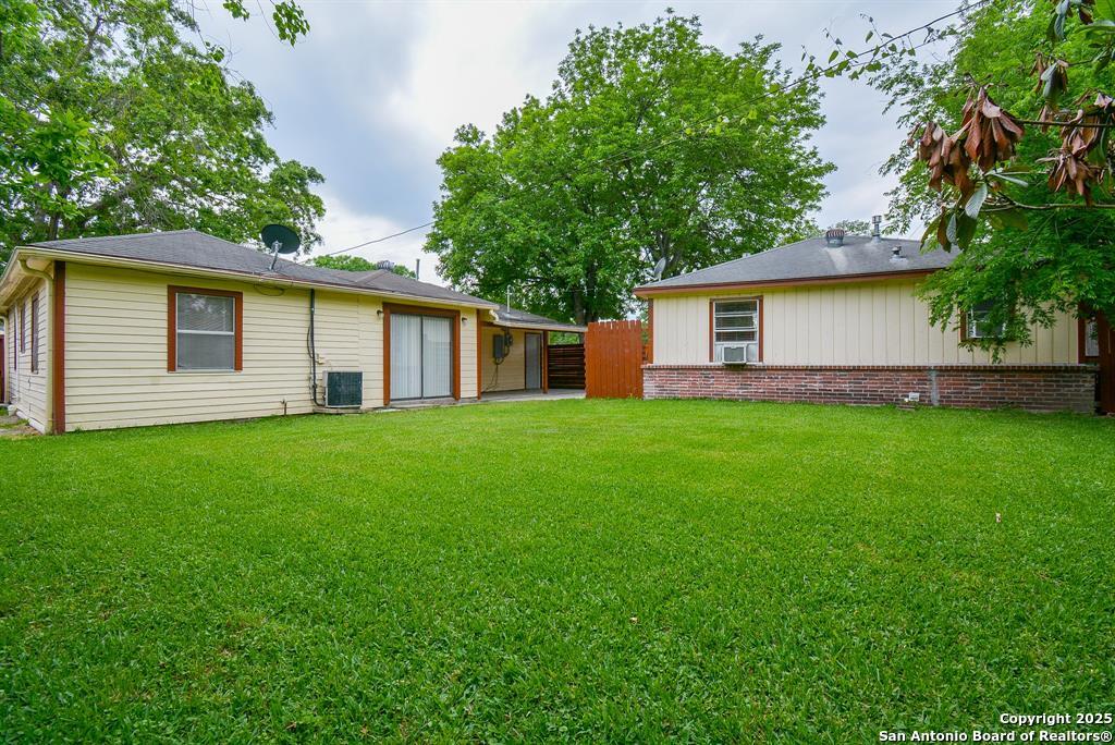 6646 1/2 Lodge Street Houston, TX 77092 - Photo 13 of 14 a house that is sitting in the grass