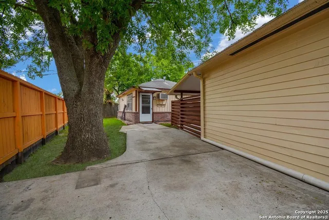 a view of a back yard with a house