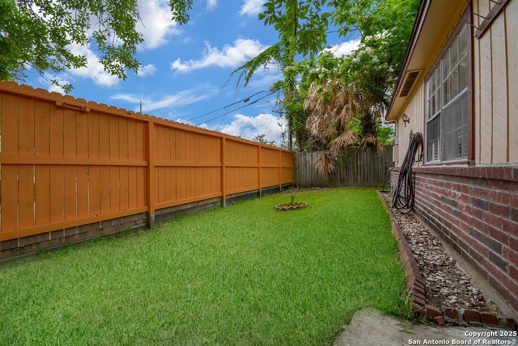 6646 1/2 Lodge Street Houston, TX 77092 - Photo 3 of 14 a view of a backyard with barn plants and large trees