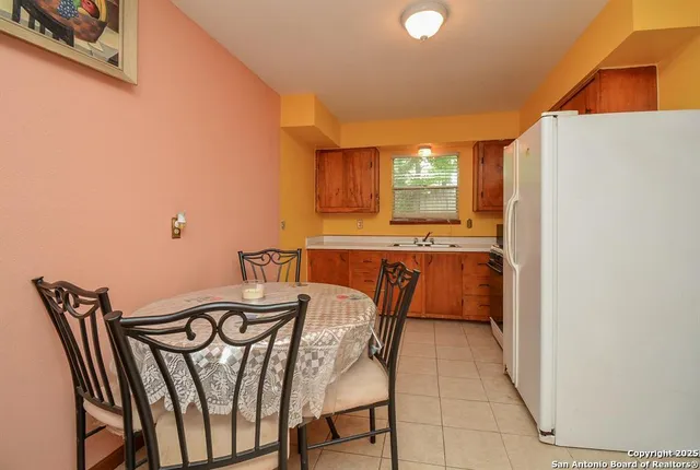 a view of a dining room with furniture and window