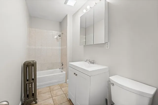 a bathroom with a sink a toilet and bathtub