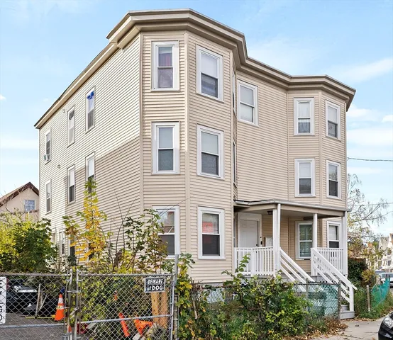 a front view of a house with a lot of plants