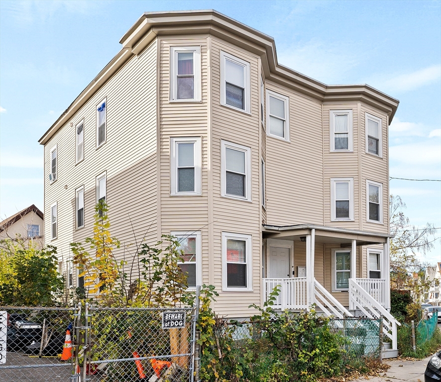 40 Ripley Road, Unit 2 Boston, MA 02124 - Photo 31 of 34 a front view of a house with a lot of plants