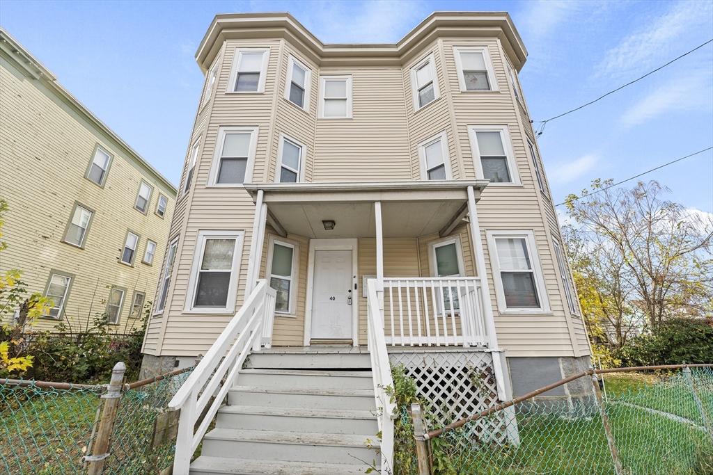 40 Ripley Road, Unit 2 Boston, MA 02124 - Photo 32 of 34 front view of a house with a yard