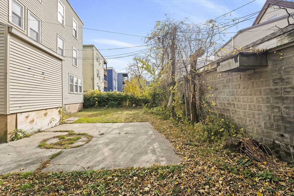 40 Ripley Road, Unit 2 Boston, MA 02124 - Photo 33 of 34 a view of a house with a yard