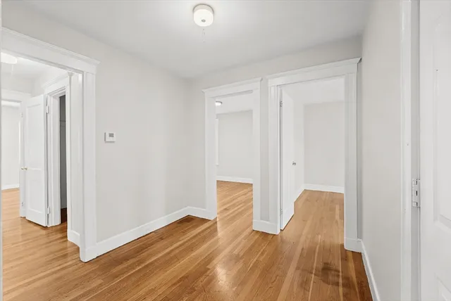 a view of a room with wooden floor and closet