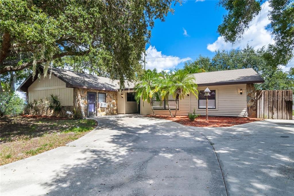 2645 Gentian Road Venice, FL 34293 - Photo 1 of 1 a front view of a house with a yard and garage