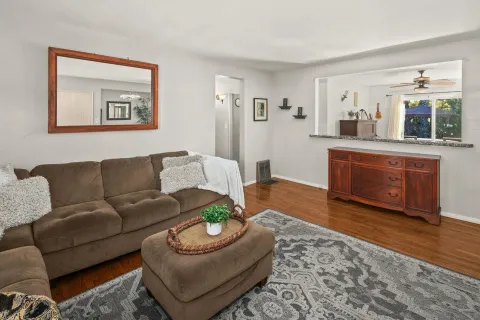 a view of a dining room with furniture and a chandelier