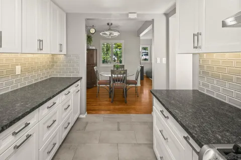 a utility room with sink dryer and washer