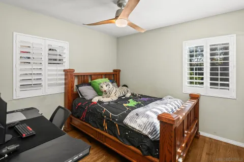 a view of a patio with table and chairs and potted plants