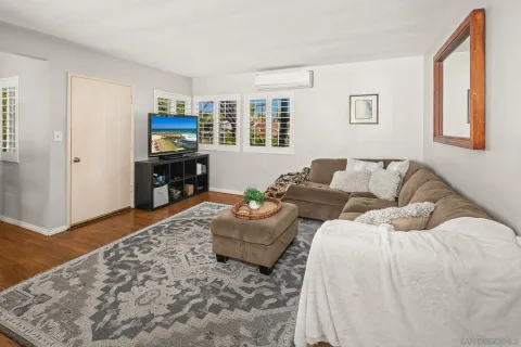 a living room with furniture and a rug