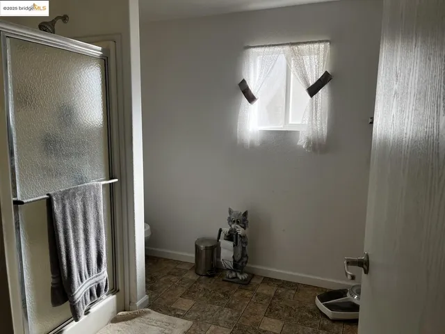 a room with window and furniture