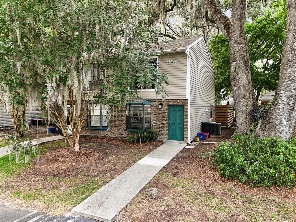 4632 Southwest 45th Lane Gainesville, FL 32608 - Photo 1 of 1 a view of a house with a yard