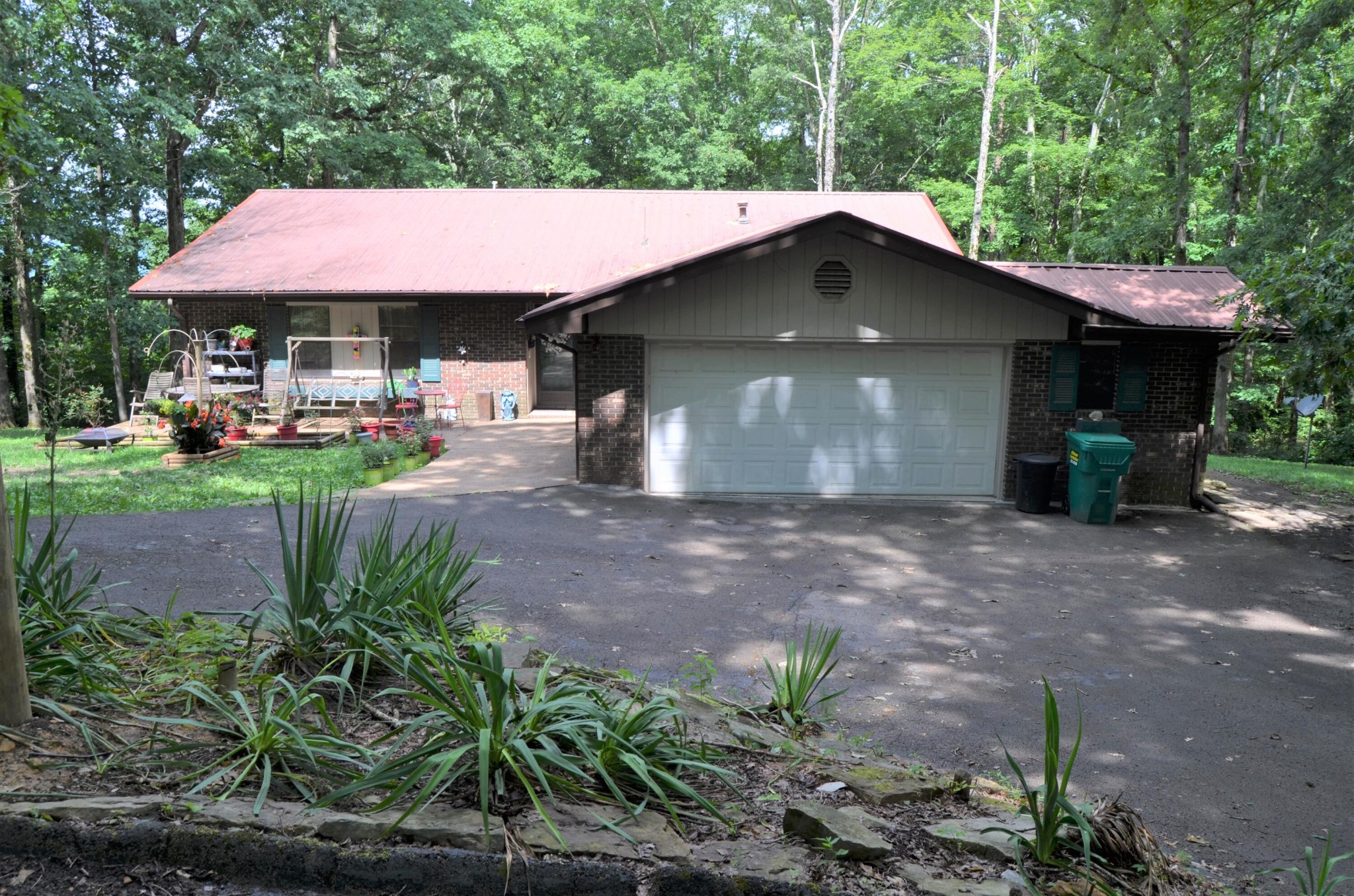 1084 Star Point Road Jamestown, TN 38556 - Photo 1 of 35 a front view of a house with garden