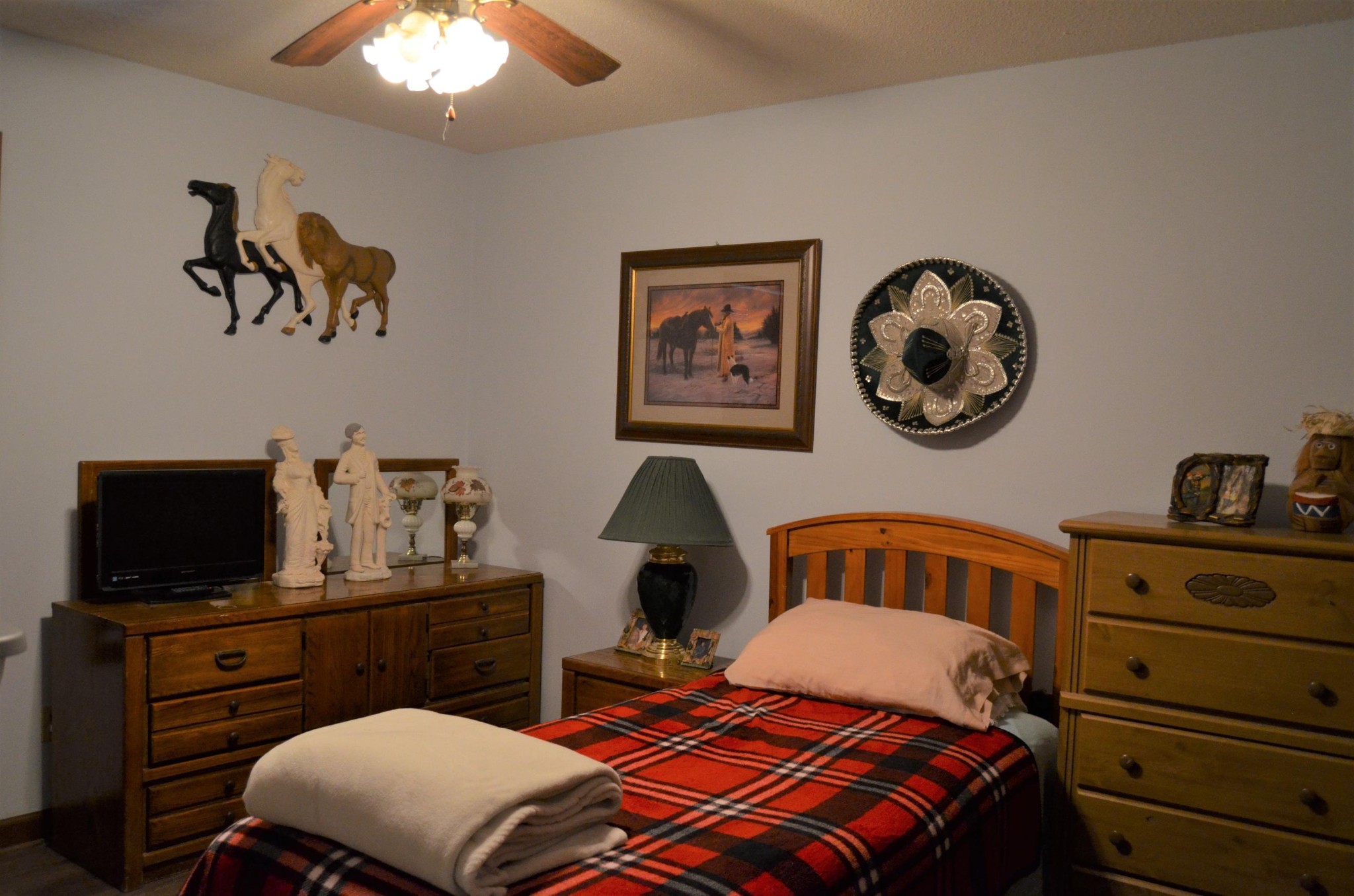1084 Star Point Road Jamestown, TN 38556 - Photo 18 of 35 a bedroom with a bed and a chandelier