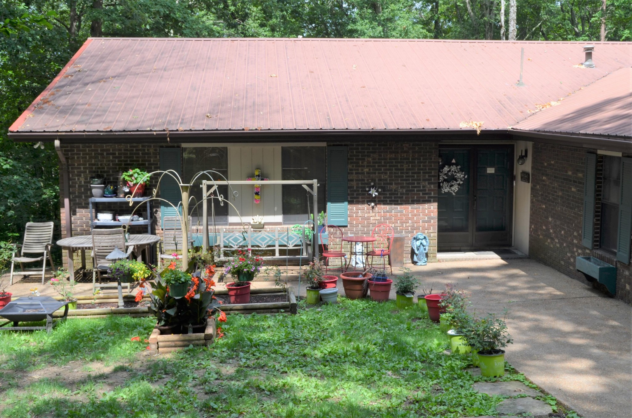 1084 Star Point Road Jamestown, TN 38556 - Photo 2 of 35 a couple of table and chairs in front of house