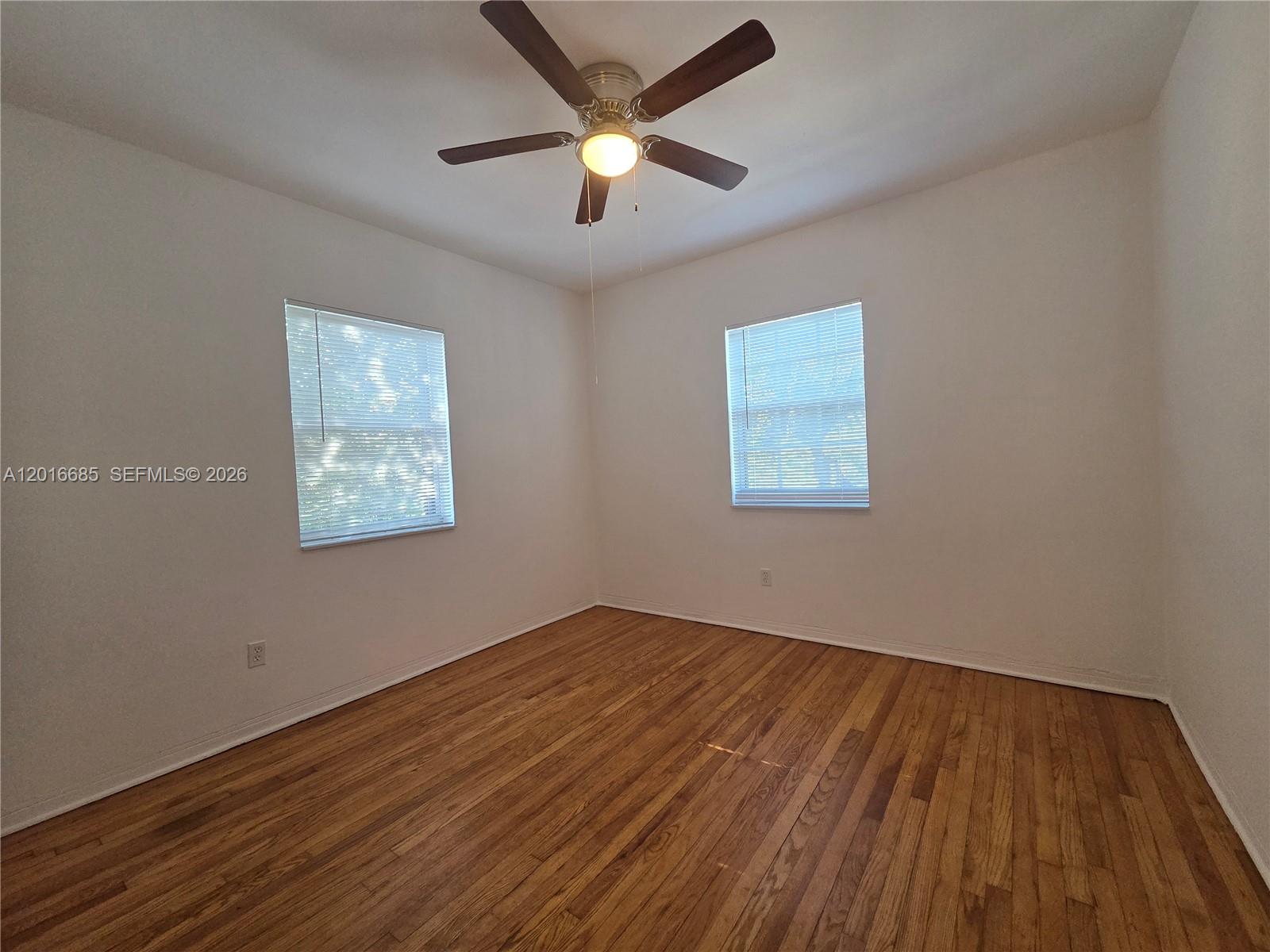 781 Southwest 11th Street, Unit 3 Miami, FL 33129 - Photo 8 of 9 a view of an empty room with wooden floor