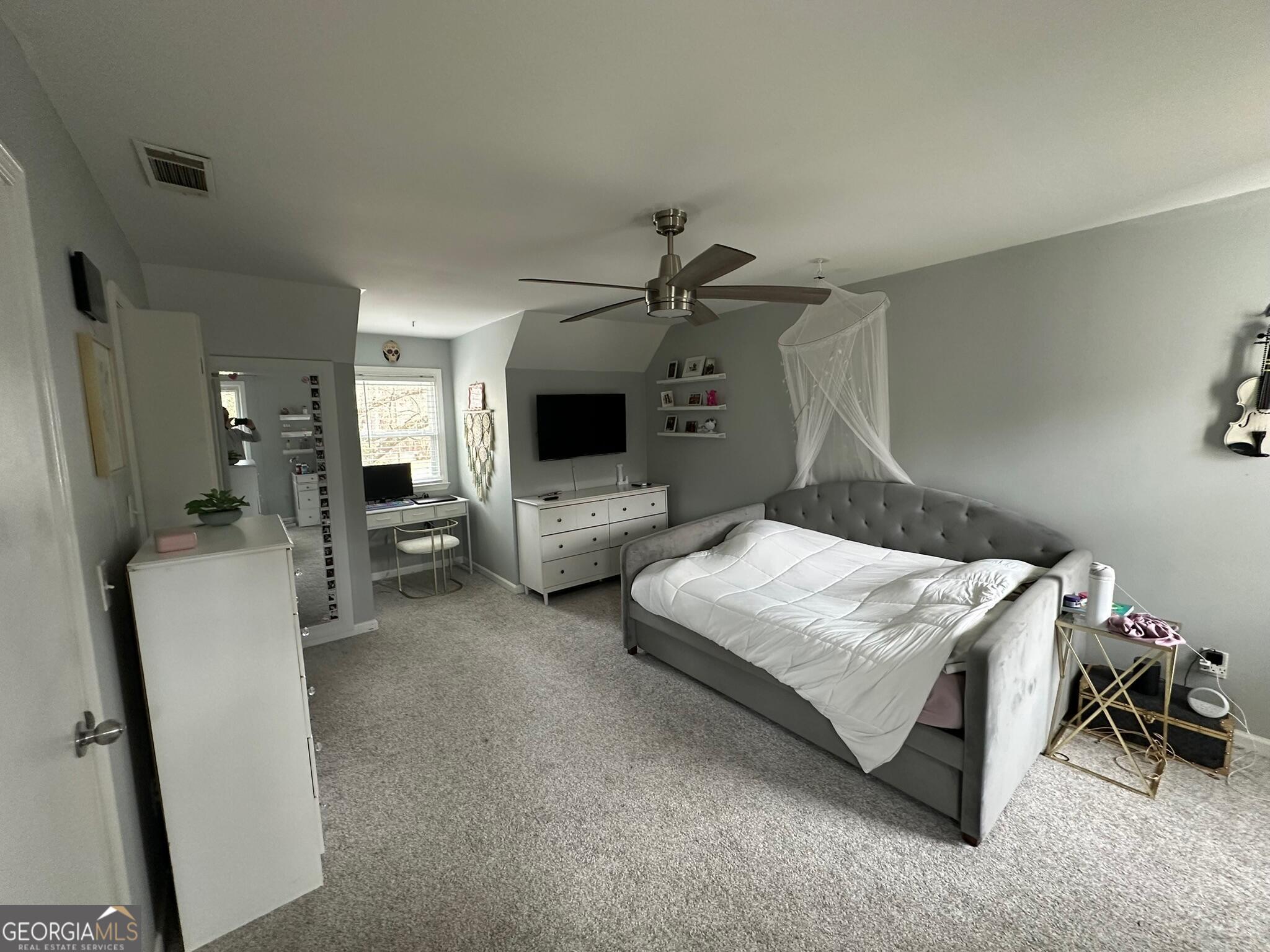 2015 Commonwealth Road Cumming, GA 30041 - Photo 17 of 22 a bedroom with bed and a flat tv screen