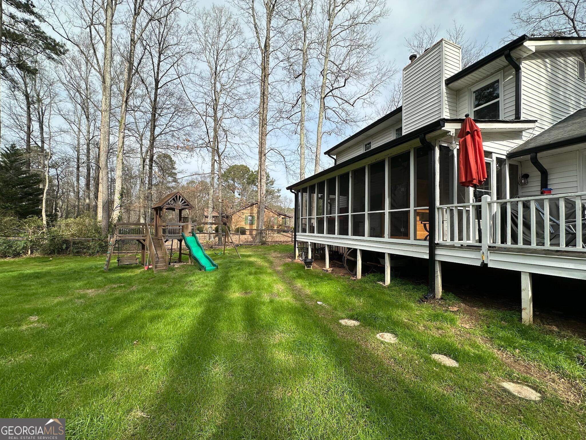 2015 Commonwealth Road Cumming, GA 30041 - Photo 18 of 22 a view of a house with a backyard