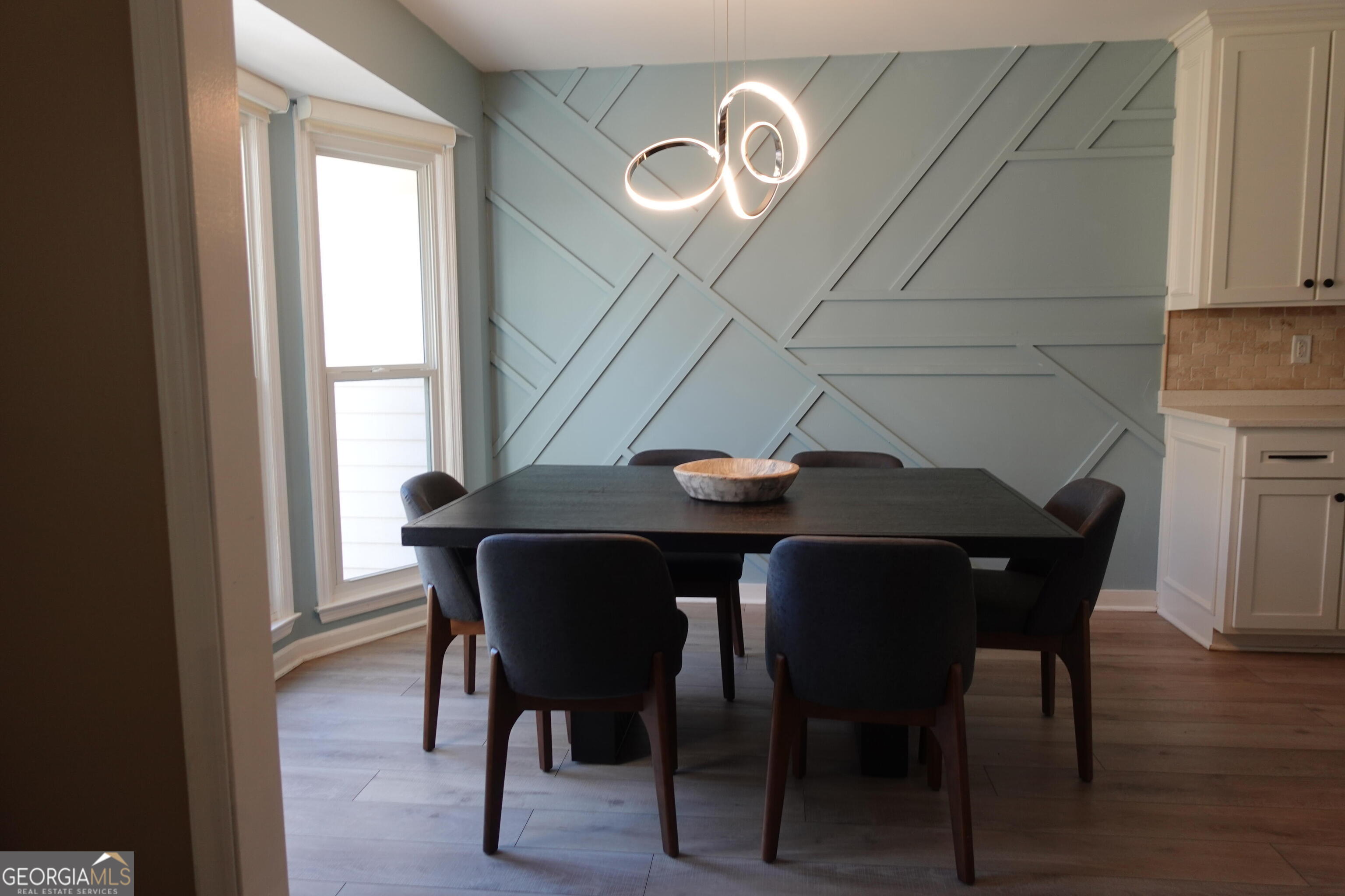 2015 Commonwealth Road Cumming, GA 30041 - Photo 5 of 22 a view of a dining room with furniture and wooden floor