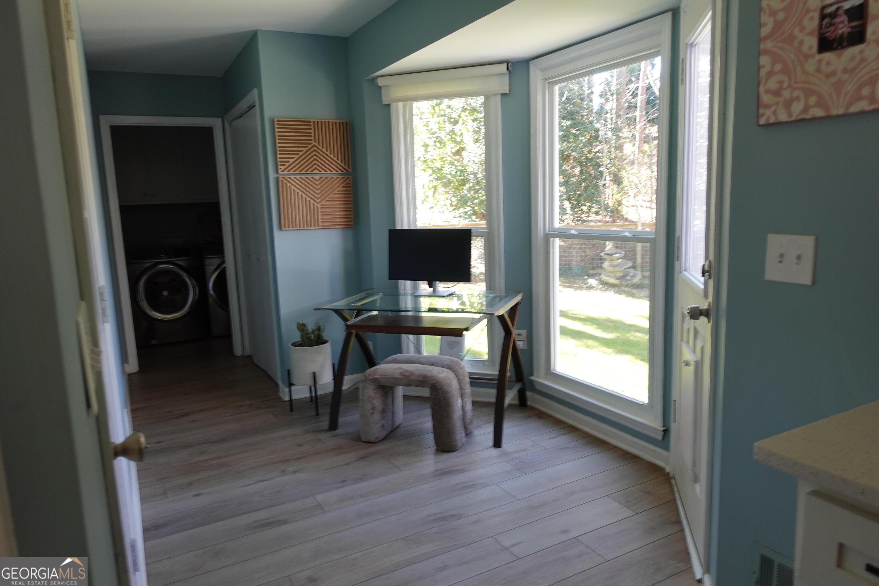 2015 Commonwealth Road Cumming, GA 30041 - Photo 6 of 22 a view of a workspace with furniture and a window