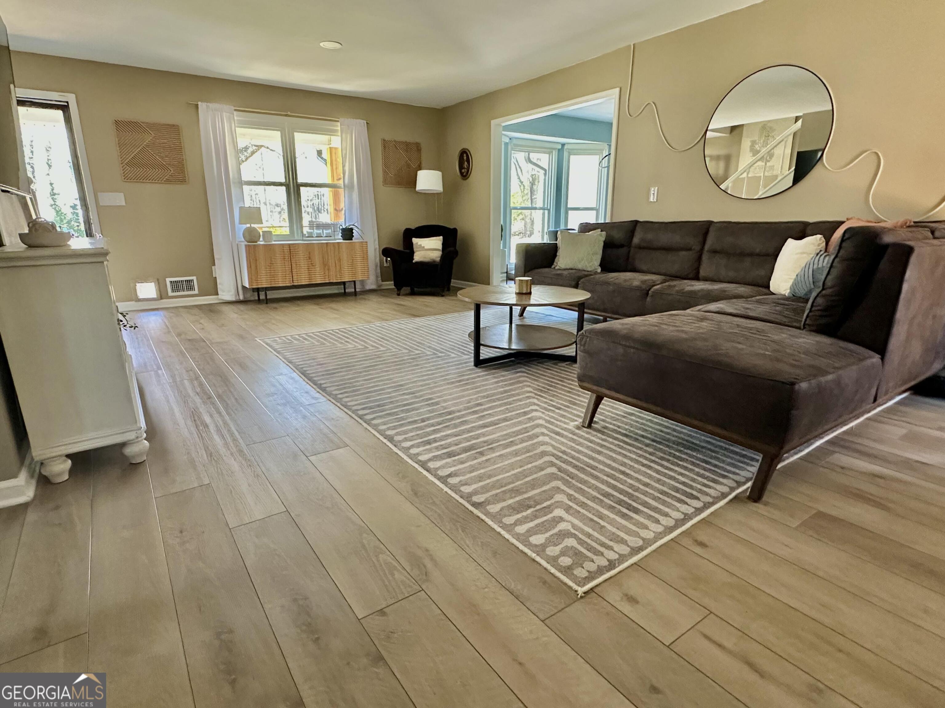 2015 Commonwealth Road Cumming, GA 30041 - Photo 9 of 22 a living room with furniture and a large window