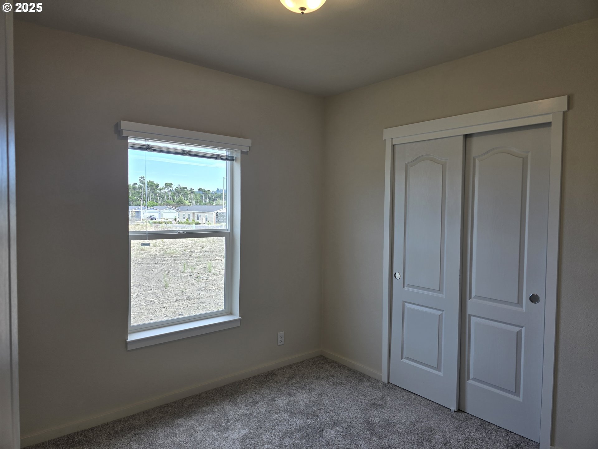 1447 53rd Street Florence, OR 97439 - Photo 12 of 25 an empty room with windows
