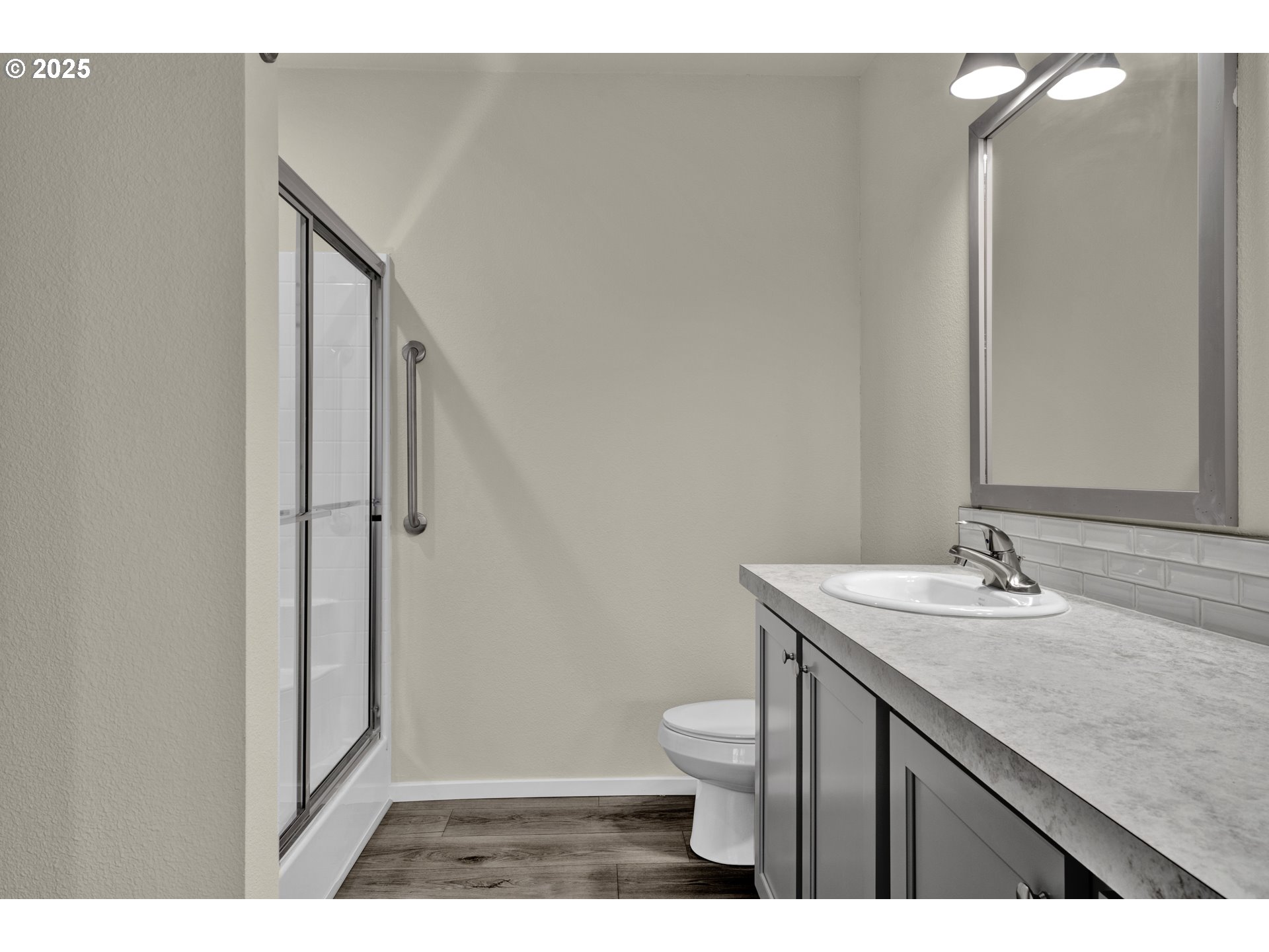 1447 53rd Street Florence, OR 97439 - Photo 16 of 25 a bathroom with a granite countertop sink toilet and shower