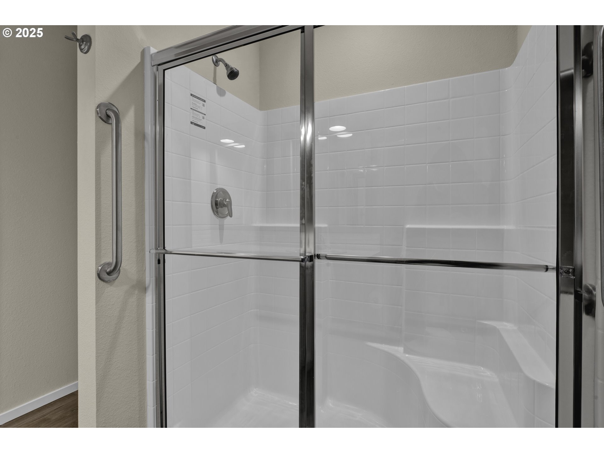 1447 53rd Street Florence, OR 97439 - Photo 17 of 25 a bathroom with a glass shower door