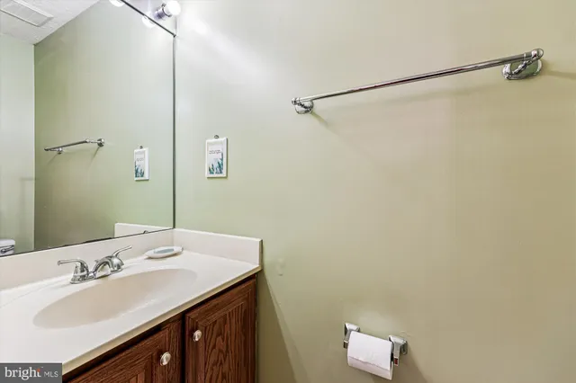 an empty room with fireplace and windows