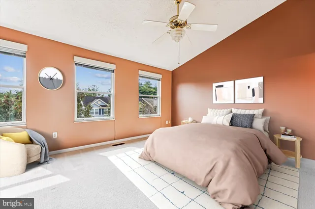 a bedroom with a large bed and a window