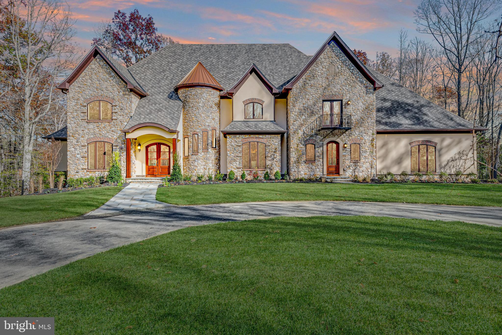 2033 Rosetta Way Davidsonville, MD 21035 - Photo 4 of 15 a front view of a house with a garden