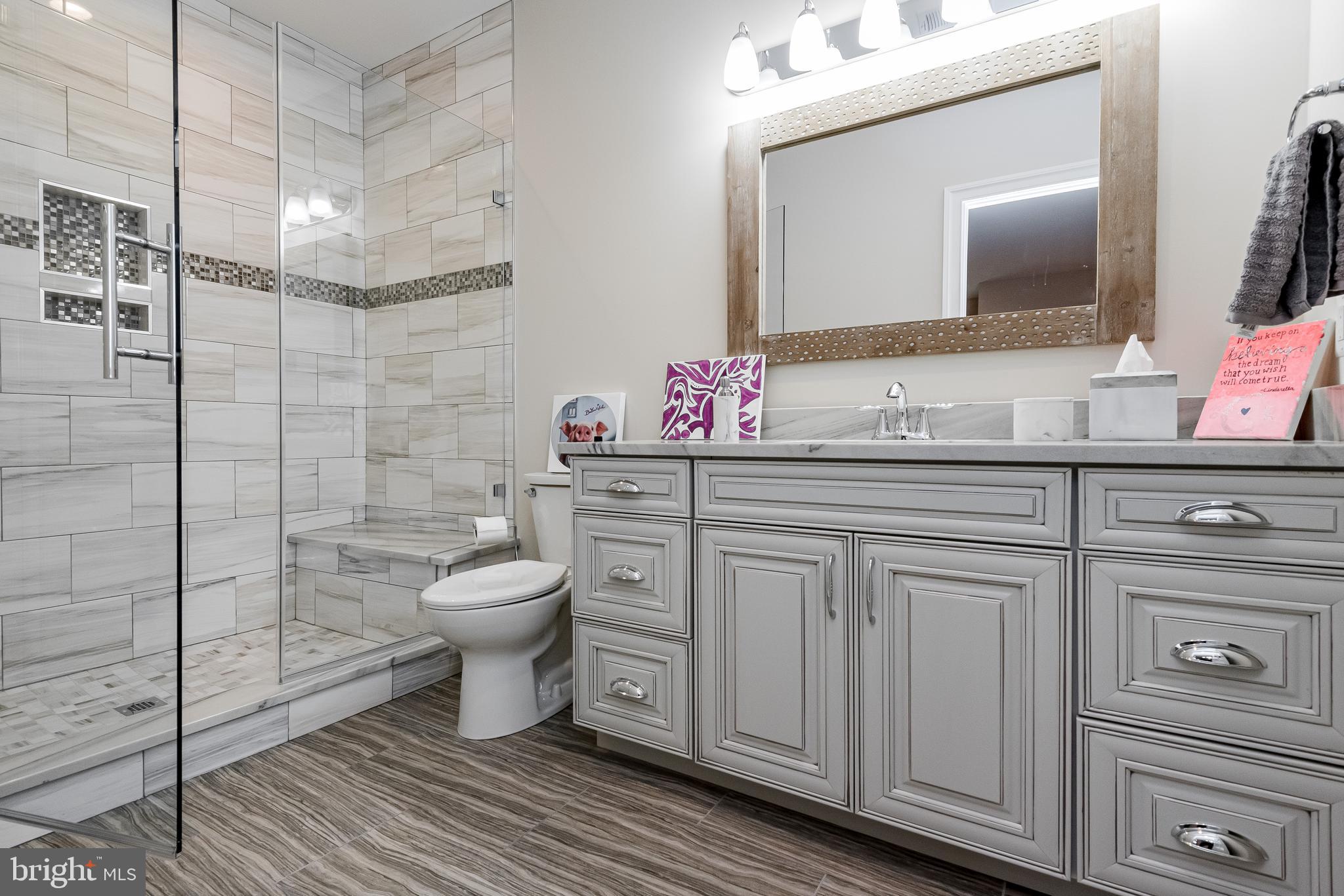 2033 Rosetta Way Davidsonville, MD 21035 - Photo 5 of 15 a bathroom with a double vanity sink mirror and toilet